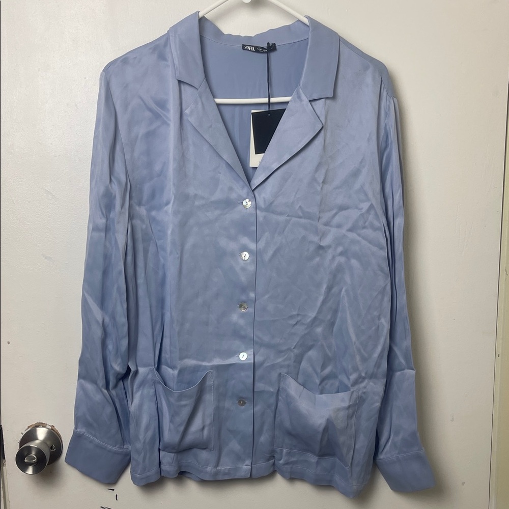 Zara Light Blue Button-Up Shirt with two pockets on the front.